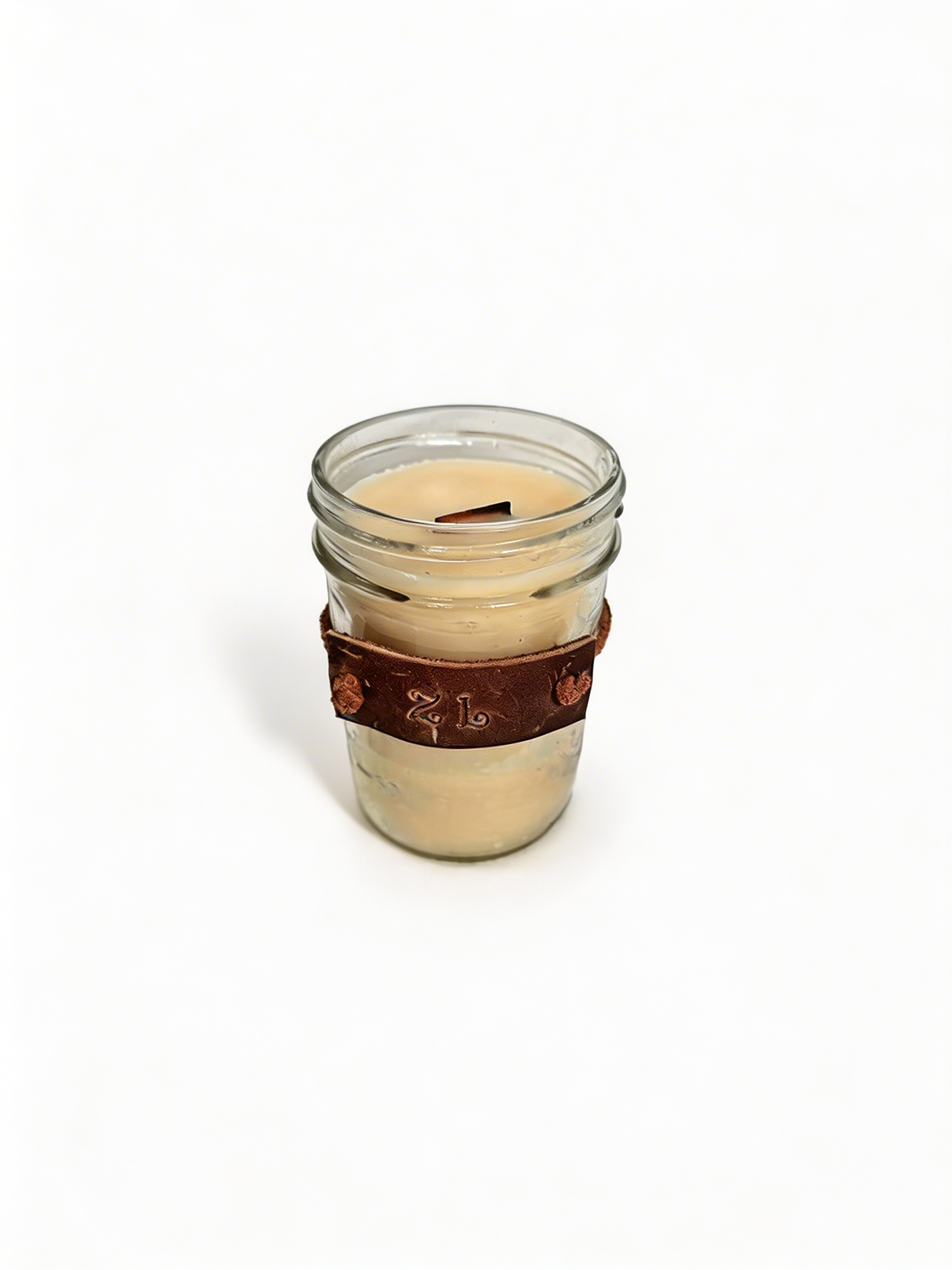 8oz mason jar with a leather sleeve on a white background